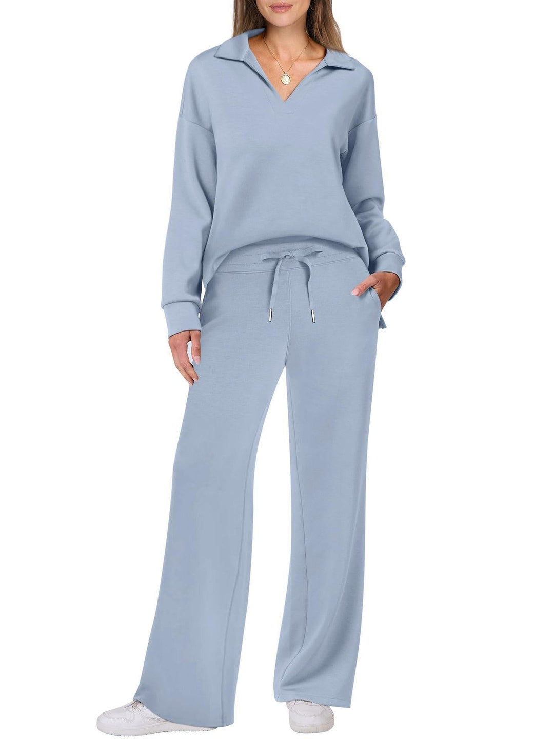Fashionable women's two-piece V-neck long sleeve top and wide leg pants loungewear for comfort.