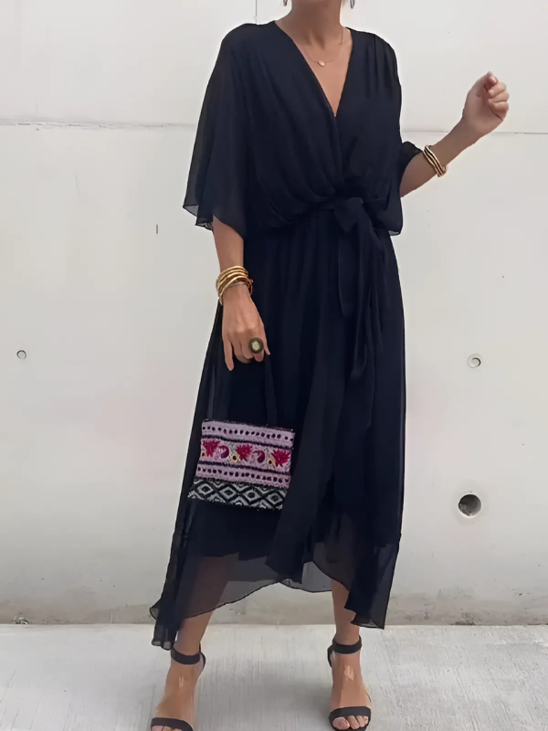 Casual V-neck maxi dress for women with an adjustable tie waist, offering a flowing silhouette and comfortable summer style.