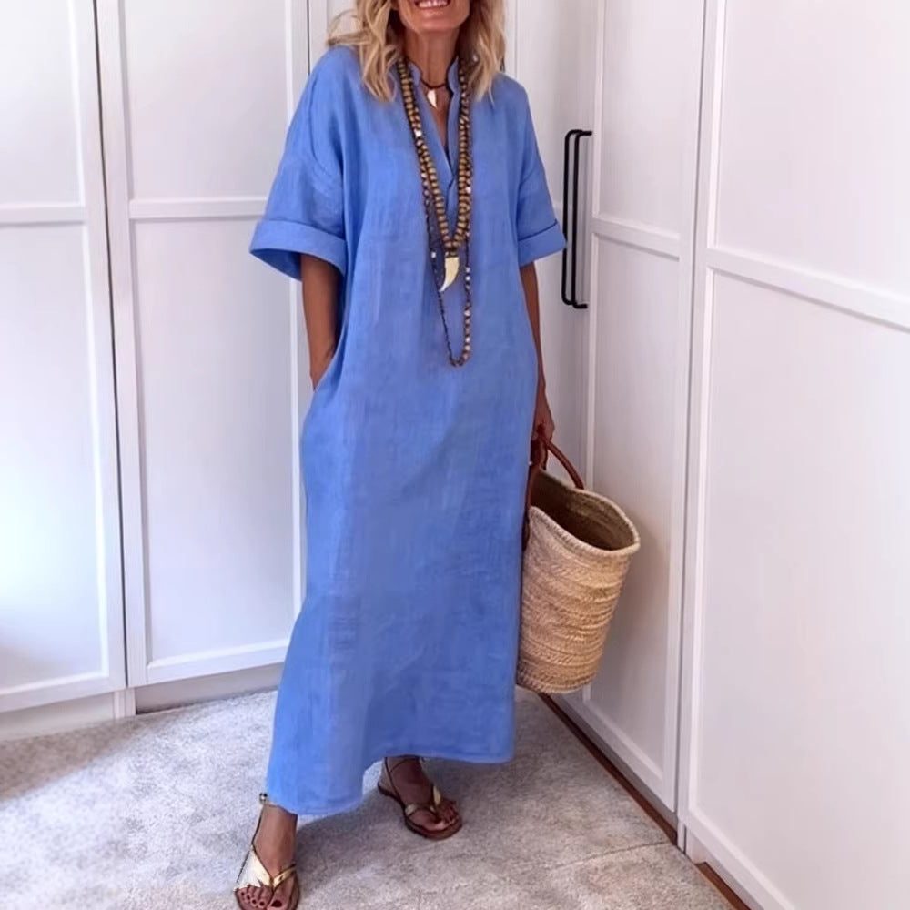 Stylish women's V-neck maxi shift dress, featuring a flattering neckline and functional pockets for convenience.