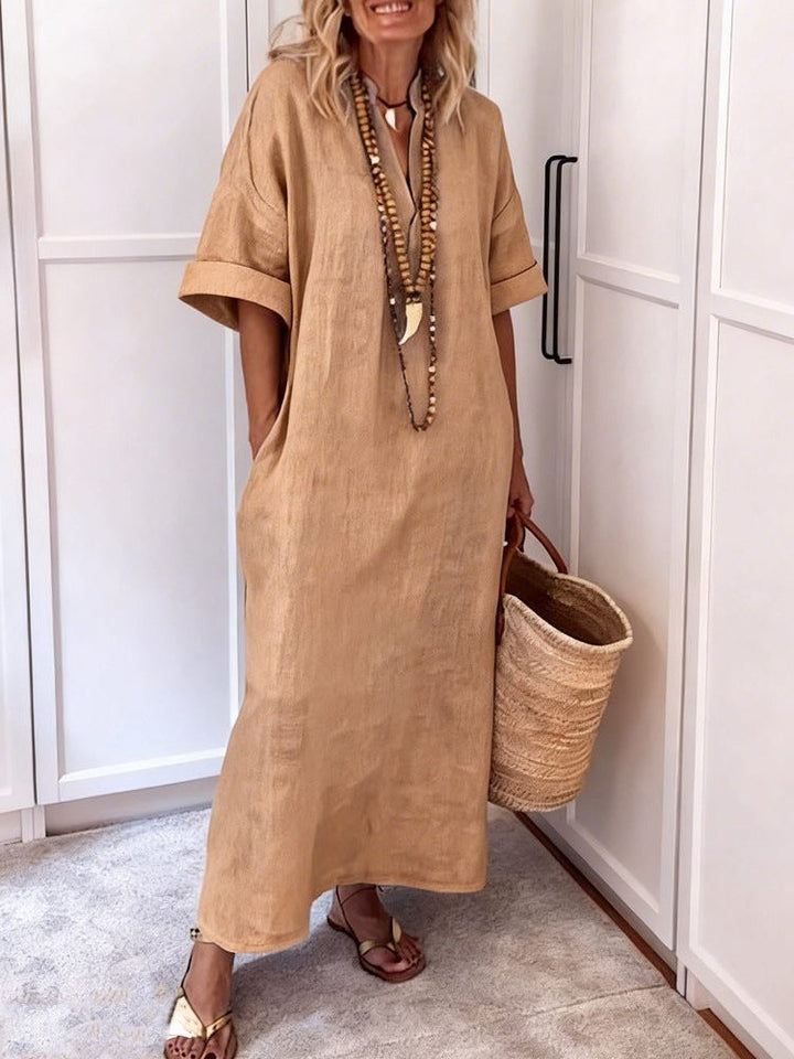 Relaxed fit women's shift maxi dress with a stylish V-neck and essential pockets, offering comfortable, easy style.