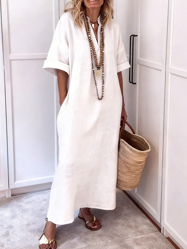Effortless women's V-neck maxi dress with pockets, a versatile shift style perfect for casual summer elegance.