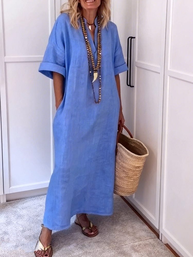 Soft women's V-neck maxi dress, a comfortable shift style with pockets, ideal for a relaxed yet chic look.