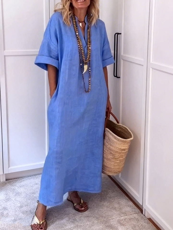 Soft women's V-neck maxi dress, a comfortable shift style with pockets, ideal for a relaxed yet chic look.