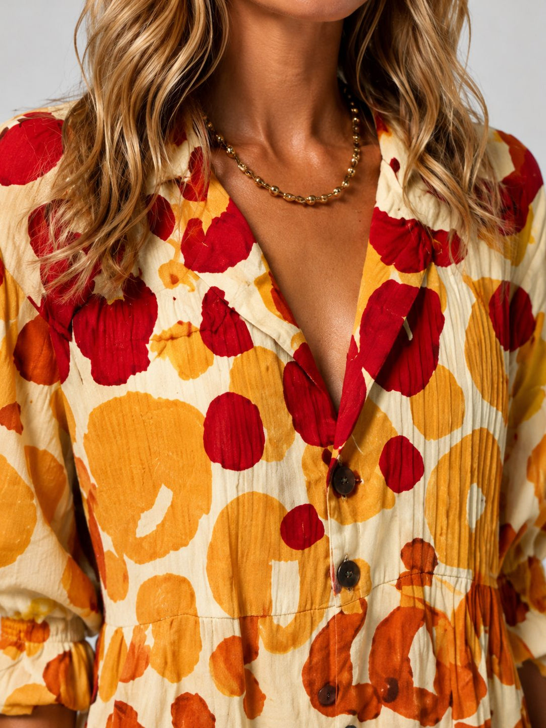 Close-up of the V-neck and button details on a versatile women's flowing maxi shirt dress.