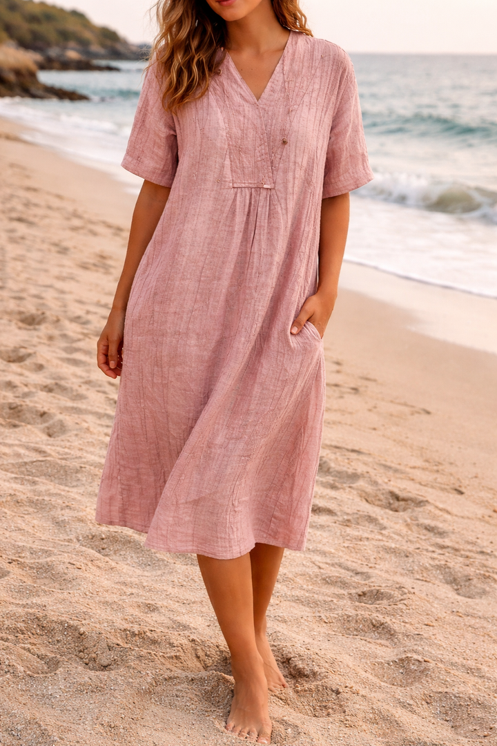 Women's V-neck midi dress with pockets, perfect for casual spring and summer wear. Loose fit, elegant design.