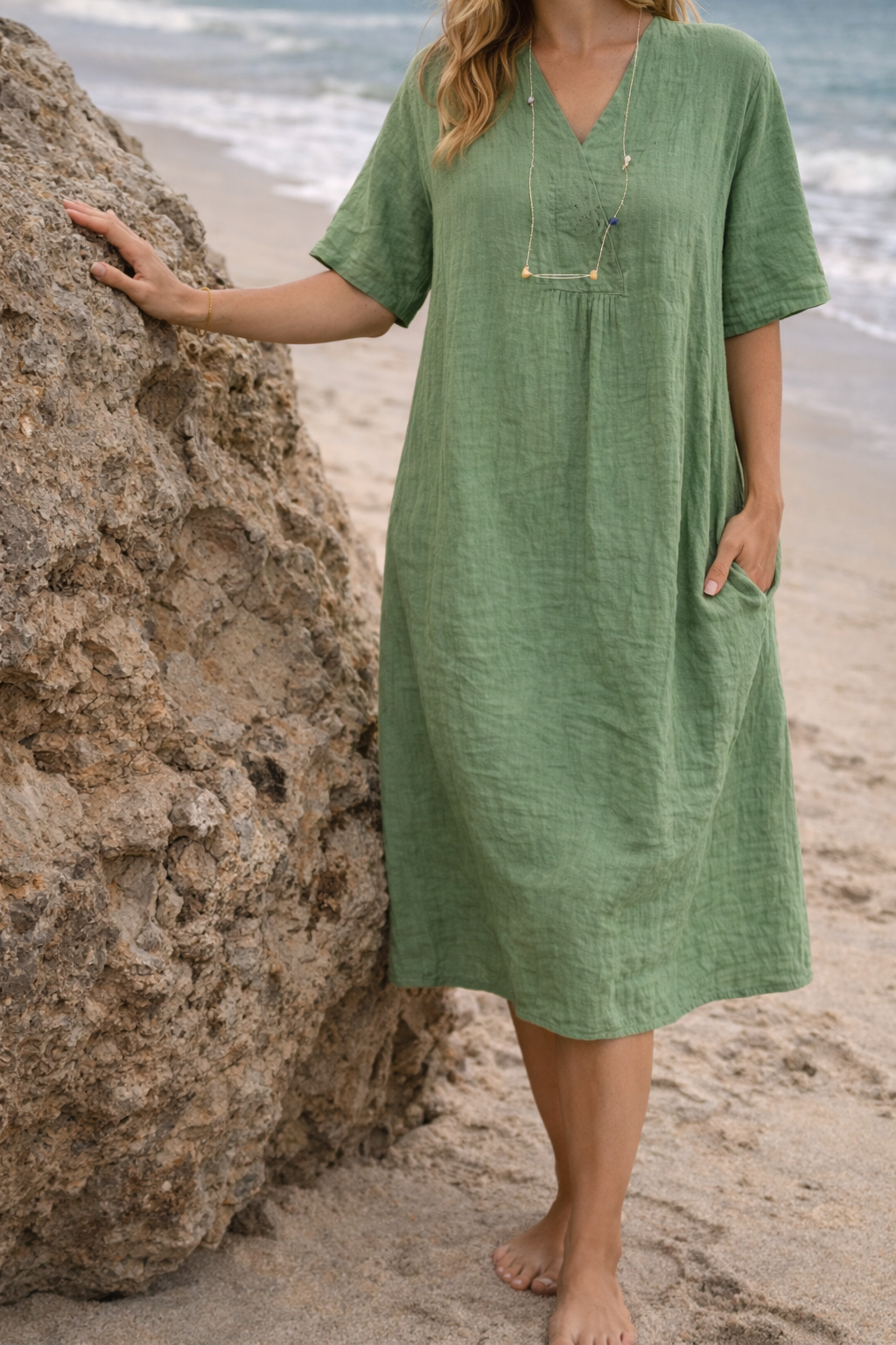 Loose fit women's short sleeve V-neck midi dress with practical pockets. Ideal for everyday casual comfort and style.