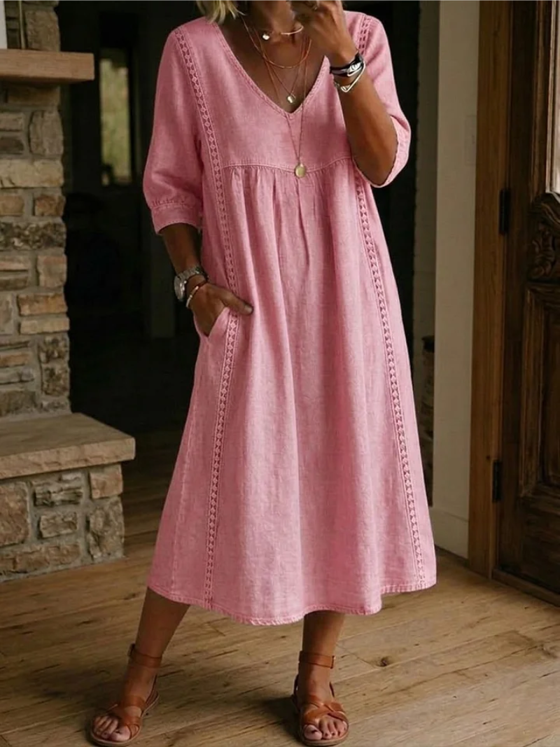 Women's V-neck midi dress with practical pockets. Comfortable & stylish for casual or smart casual wear.