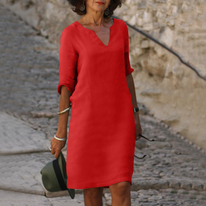 Women's V-neck midi shift dress with 3/4 sleeves. Comfortable & casual everyday fashion.