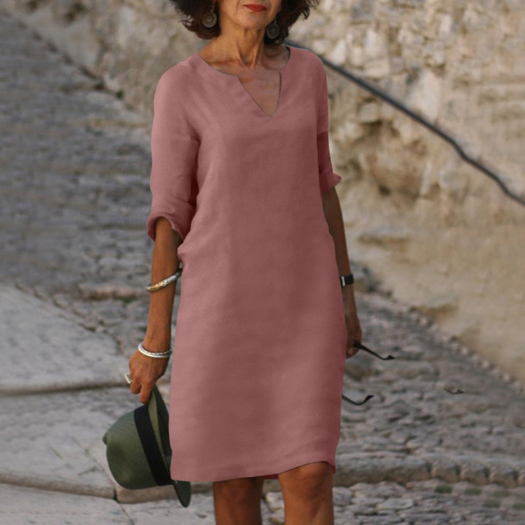 Elegant women's V-neck midi shift dress, ideal for casual and everyday comfort.