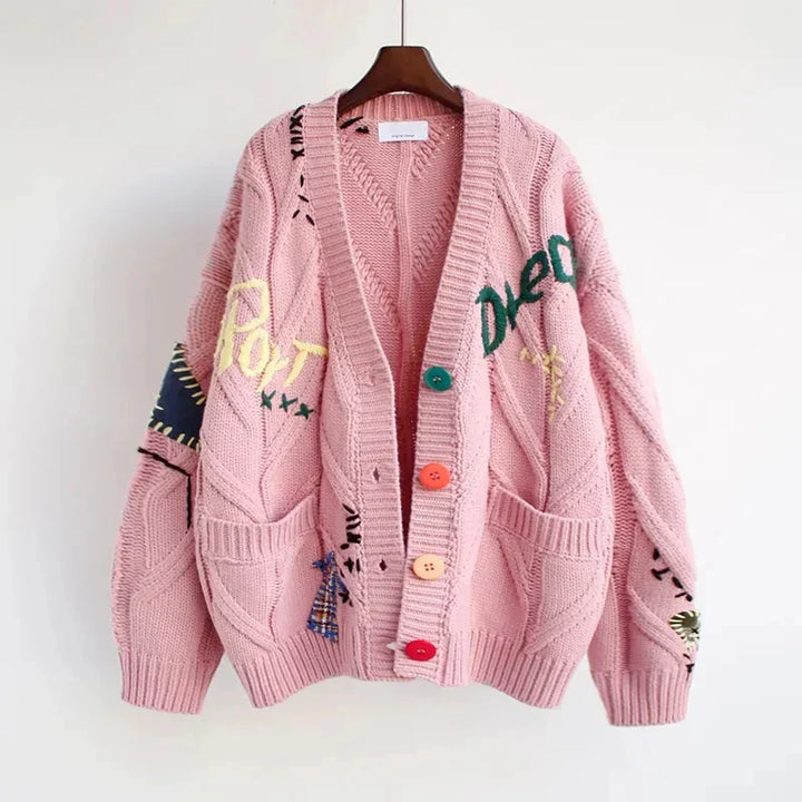 Relaxed fit V-neck cardigan with intricate patchwork embroidery, perfect for spring layering or winter wear.