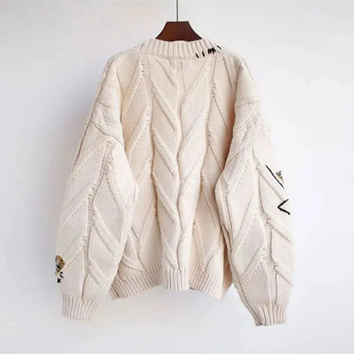 Embroidered V-neck patchwork cardigan, a relaxed fit women's top for casual, bohemian fall fashion.