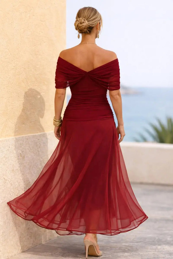 V-neck flutter sleeve maxi dress with ruched waist, a chic plus size formal option.