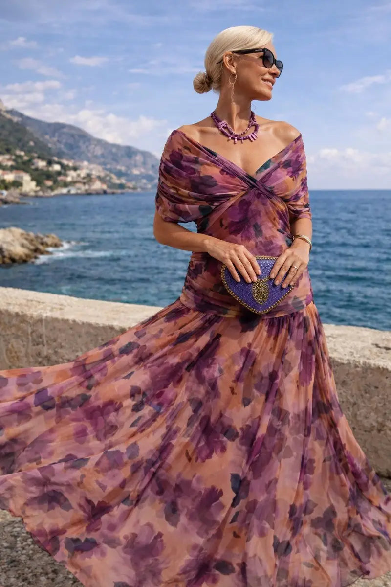 Women's V-neck formal occasion dress. Ruched waist & flowy maxi skirt for elegance.