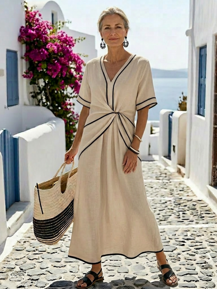 Elegant women's V-neck short sleeve midi dress featuring a comfortable gathered waist. Summer fashion.