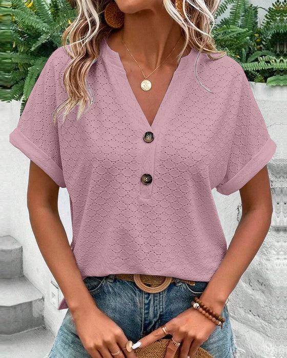 Women's V-neck textured short sleeve blouse, ideal for spring & summer casual or elegant wear.