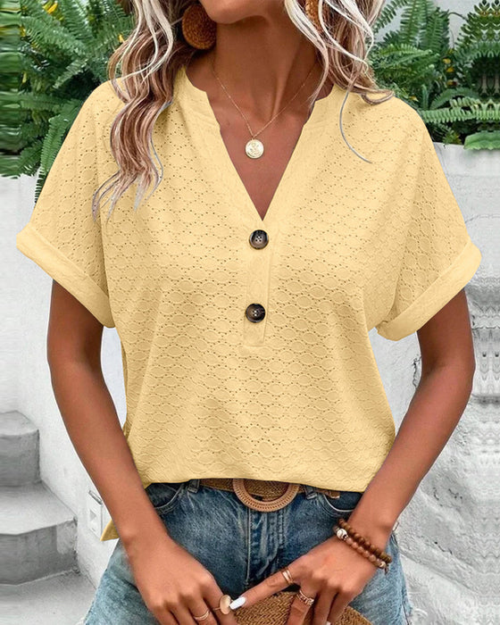 Chic women's V-neck textured short sleeve blouse featuring delicate button detail, versatile for any season.