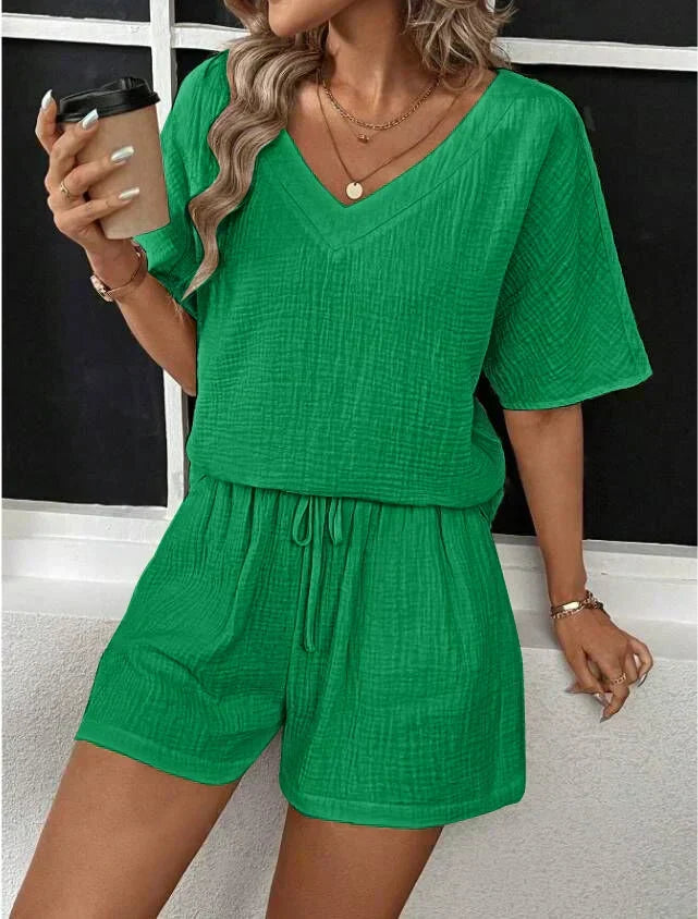 Women's V-neck top and shorts set in soft fabric, perfect for comfortable summer casual wear & daywear.