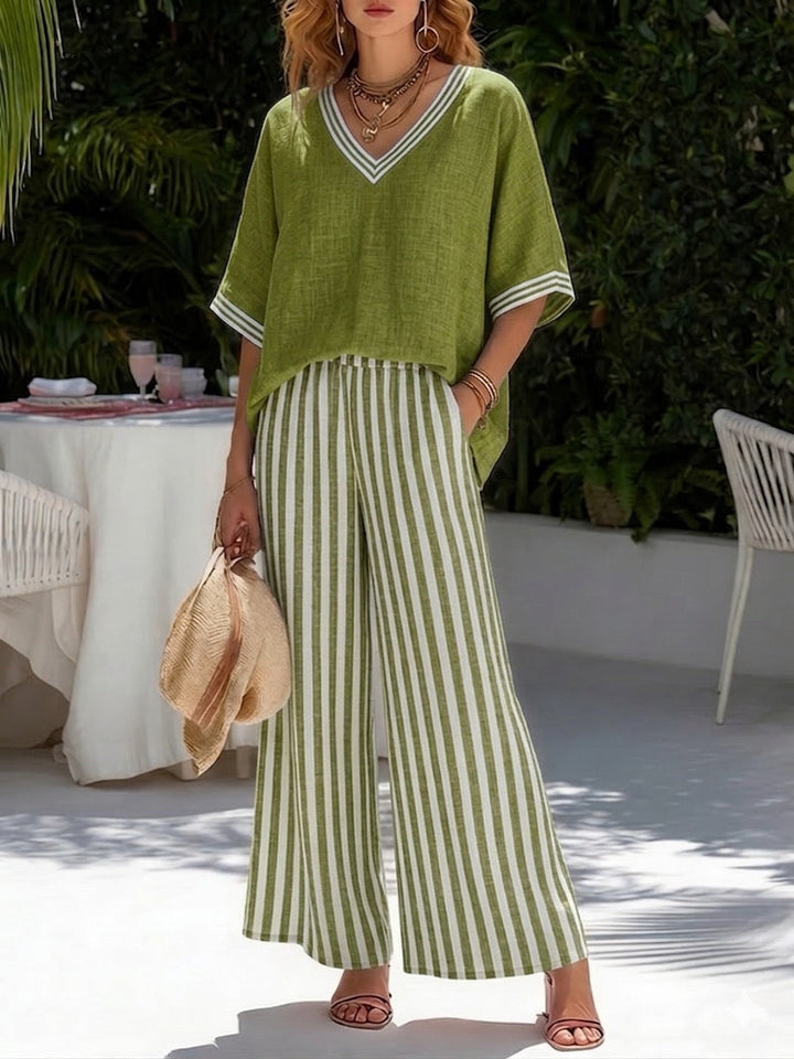 Women's V-neck top and vertical striped trousers set. A comfortable, elegant two-piece outfit for summer.