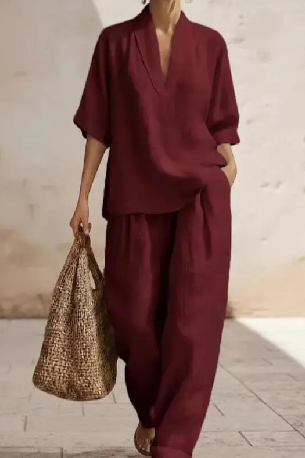 Chic women's V-neck top & wide leg trousers two-piece set. A stylish and comfortable coord for modern women.