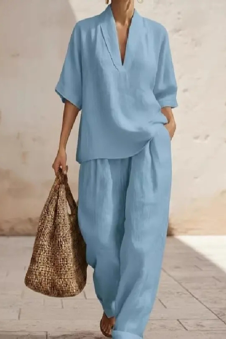Modern women's V-neck top and wide leg trousers co-ord. This two-piece set offers comfort and style.