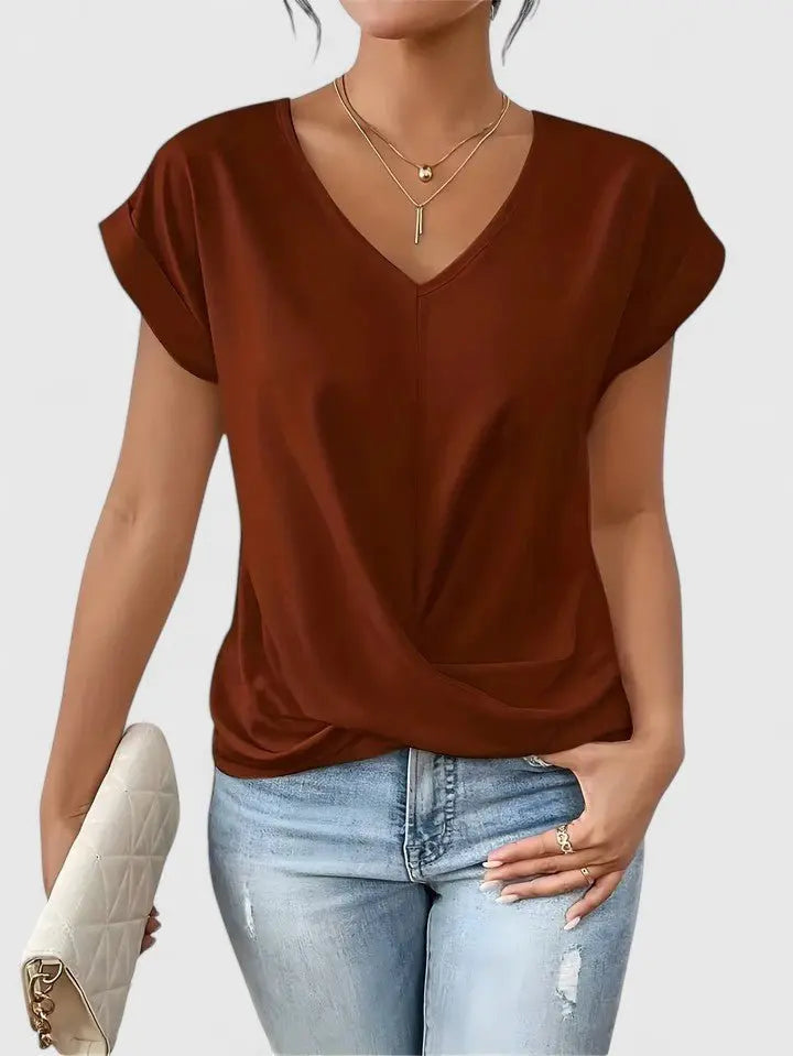 Elegant women's V-neck blouse with a distinctive twist front & short sleeves; a versatile everyday fashion piece.