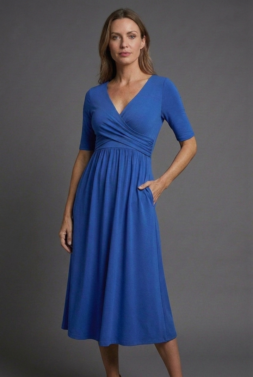 Lightweight women's V-neck midi summer dress. Comfortable short sleeve wrap style with pockets for effortless fashion.
