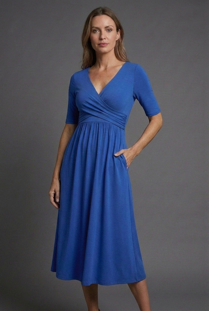 Lightweight women's V-neck midi summer dress. Comfortable short sleeve wrap style with pockets for effortless fashion.