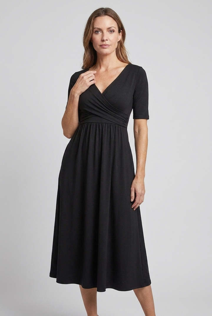 Model wearing a flattering women's V-neck wrap midi summer dress with pockets. Perfect for ladies' fashion.