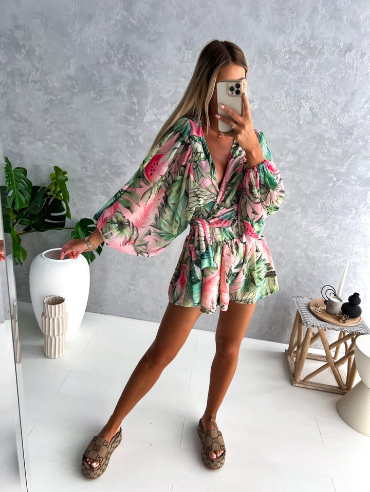 Women's V-neck wrap blouse and matching shorts set with a flattering tie waist, ideal for summer elegance.