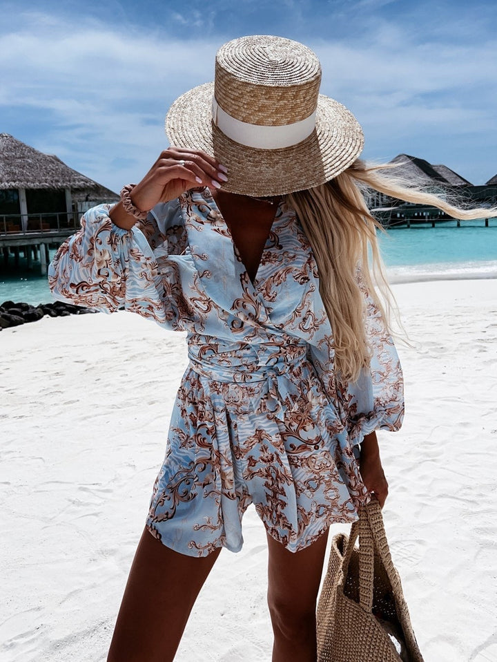 Chic women's two-piece V-neck wrap short set, featuring a stylish tie waist. Perfect for brunch.