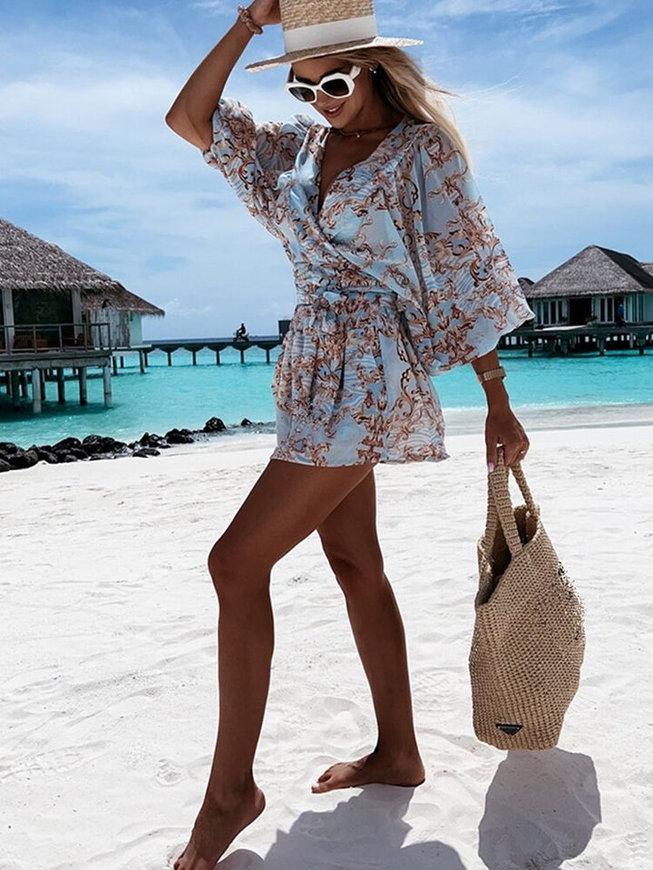 Elegant women's V-neck short set with wrap front, balloon sleeves, and tie waist. Coordinated summer outfit.