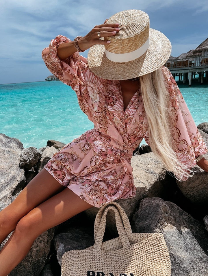 Stylish two-piece women's short set: V-neck wrap top & matching shorts, adjustable tie waist. Brunch ready.