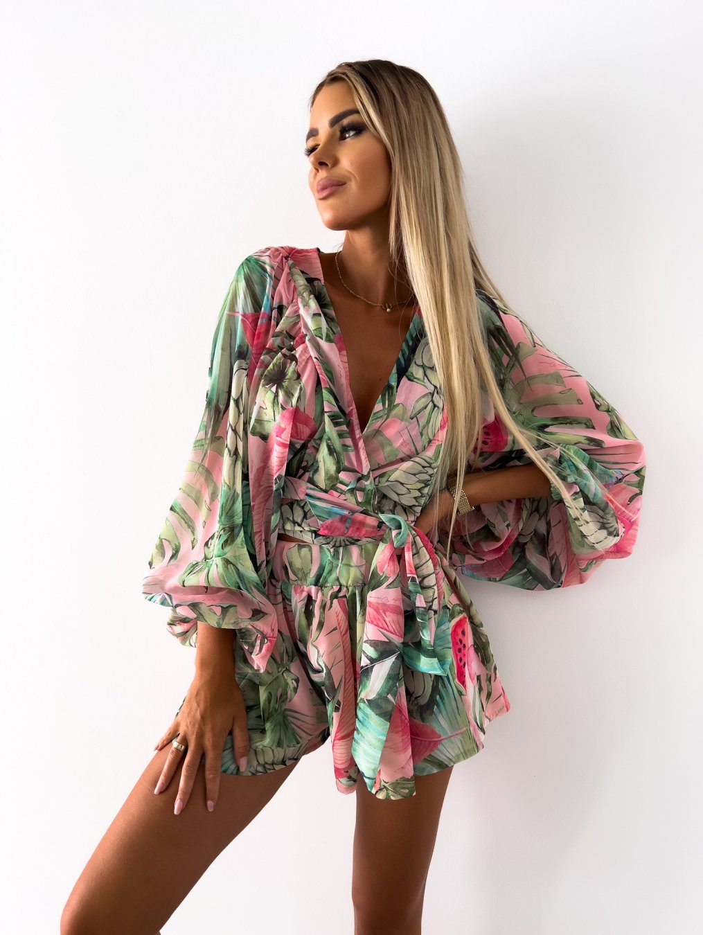 Casual summer women's short set, V-neck wrap design, comfortable shorts, and a fashionable tie waist.