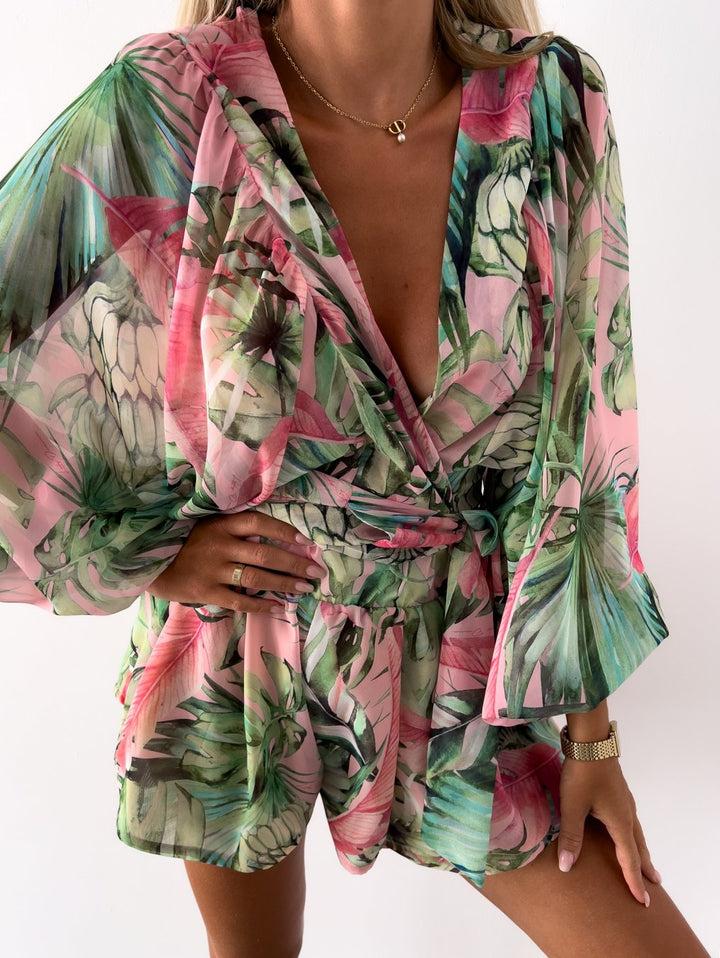 Perfect brunch outfit: women's V-neck wrap front short set, tie waist, and modern balloon sleeves.