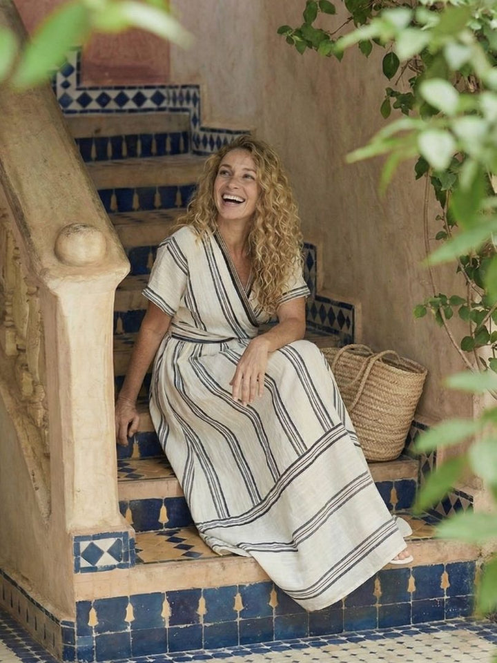 Flattering women's short sleeve V-neck wrap midi dress. A stylish, casual summer dress for easy everyday wear.