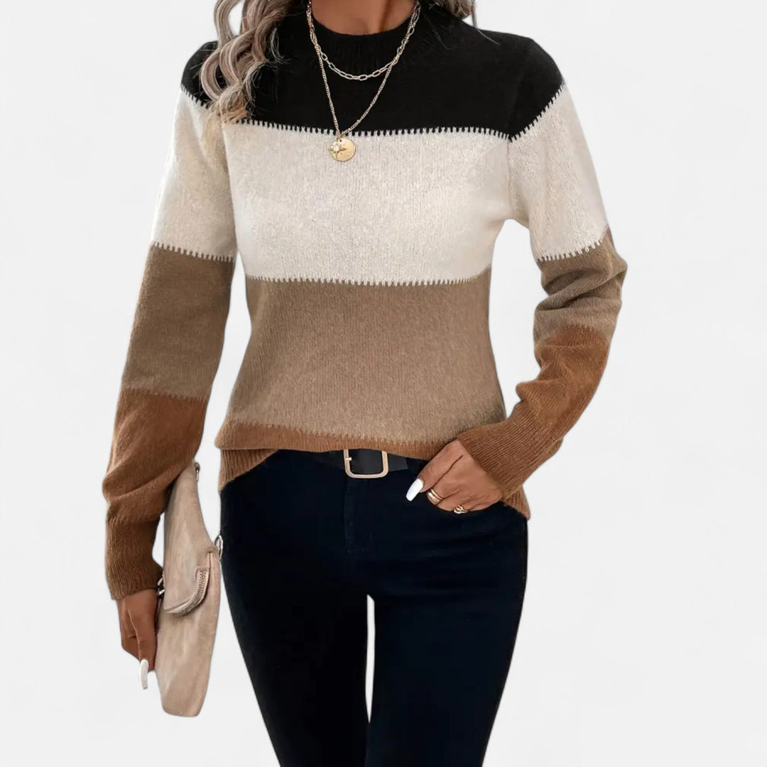 Model wearing a chic women's striped crew neck sweater, ideal for everyday casual wear or an elegant outfit.