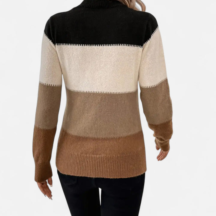 Soft knit women's striped crew neck sweater, providing lightweight comfort and a touch of effortless elegance.