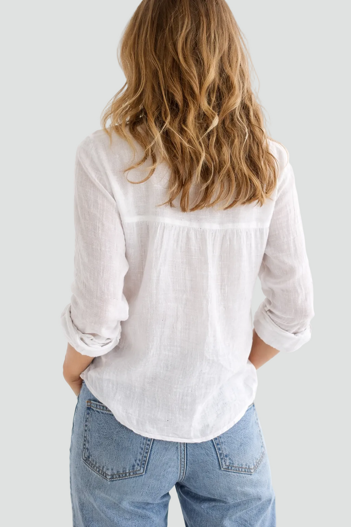 Casual long sleeve button-down blouse for women, ideal for relaxed everyday style or summer layering.