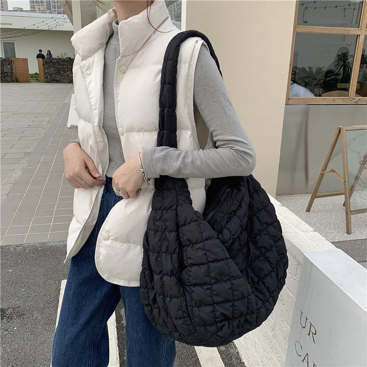 Women's versatile down shoulder bag, lightweight & spacious, perfect for travel or everyday use. Chic & comfortable.