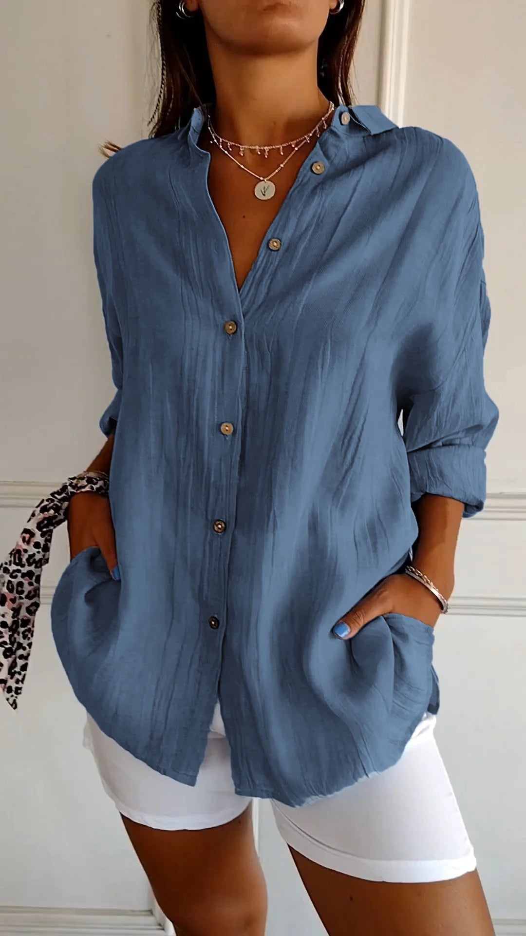 Relaxed fit women's button down shirt, a chic long sleeve top for comfortable everyday fashion.