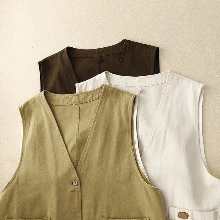 Elegant women's sleeveless vest. Button front V-neck top with pockets for stylish spring & summer casual outfits.