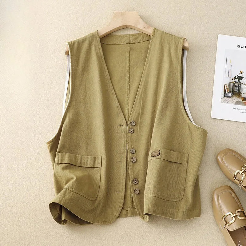 Relaxed fit women's sleeveless vest with button front & pockets. Comfortable V-neck layering top for everyday wear.