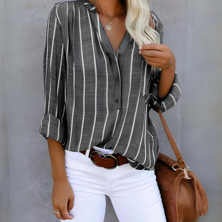 Women's button-down blouse showcasing a sophisticated vertical stripe pattern & flattering 3/4 sleeves.