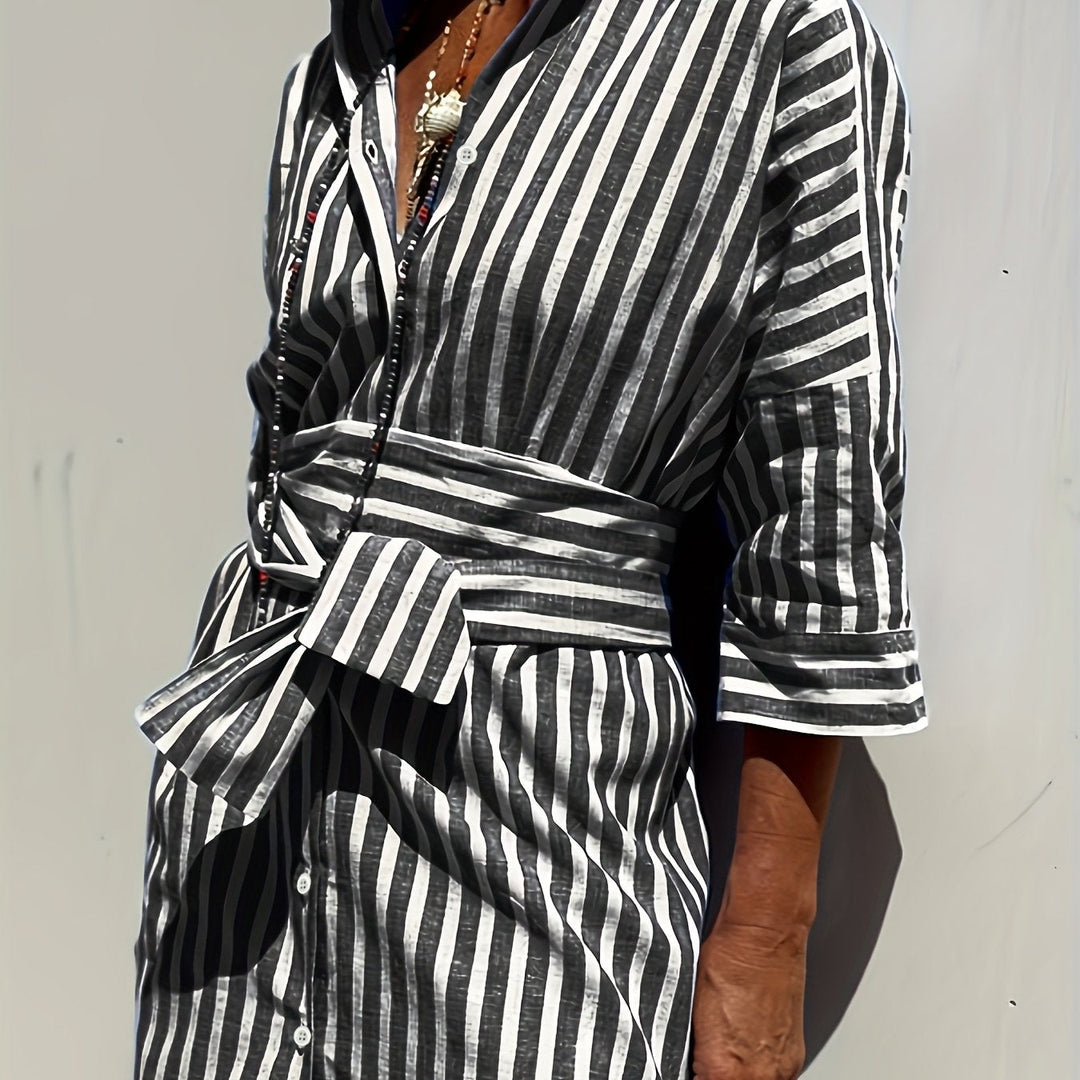 Yellow striped button-front dress, women's, with belt, three-quarter sleeves & split hem.