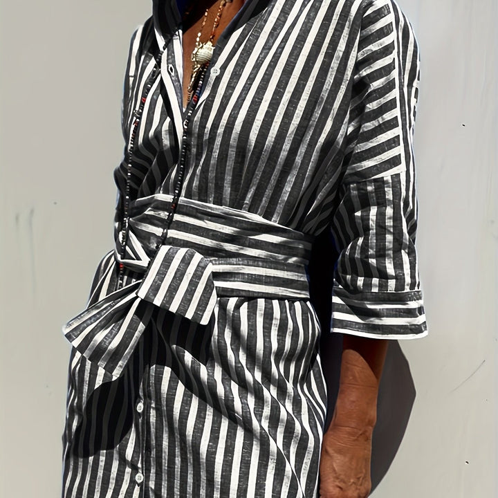 Yellow striped button-front dress, women's, with belt, three-quarter sleeves & split hem.