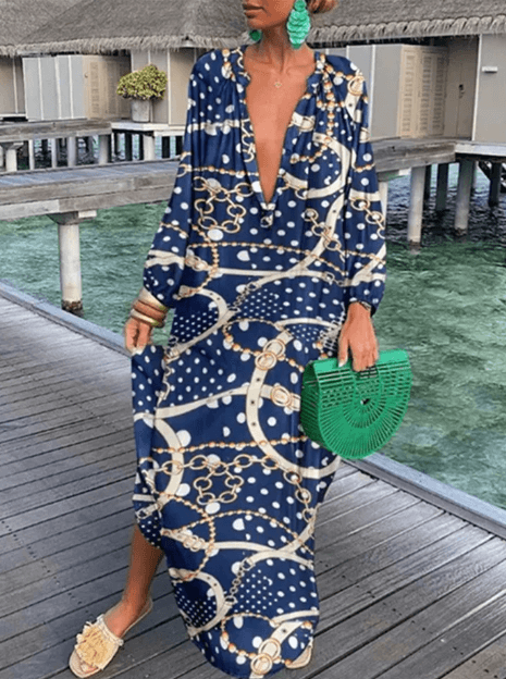 Casual women's vibrant printed summer dress. Sleeveless, round neck sundress, perfect for versatile fashion.