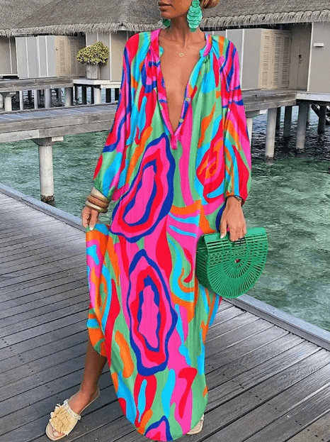 Elegant women's vibrant printed sundress. Sleeveless round neck casual summer dress for stylish fashion.