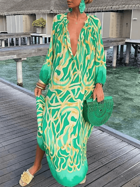 Chic women's vibrant patterned summer dress. Sleeveless, round neck, perfect casual sundress.