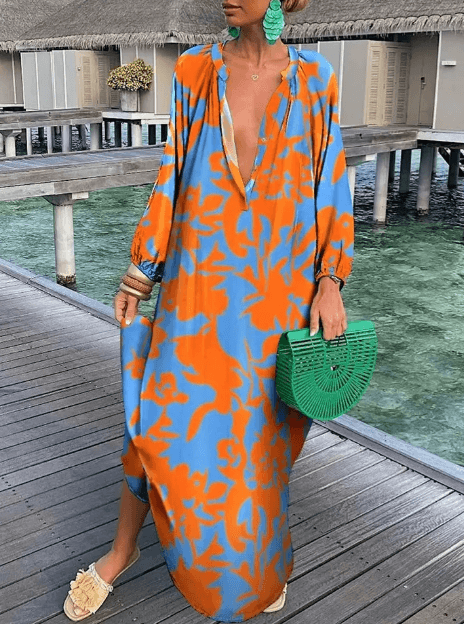 Women's vibrant printed sleeveless summer dress. Round neck, casual sundress, ideal for fashion-forward women.