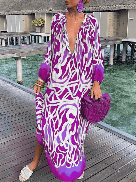 Bright women's vibrant printed summer dress. Casual sleeveless round neck sundress for lively summer fashion.